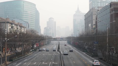 Beijing / China - 01 27 2020: Coronavirus Deserted Beijing Main Street during Rush Hour