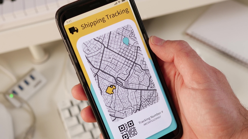 Tracking a parcel using a mobile phone app showing the delivery truck driving on the street. Royalty-Free Stock Footage #1048441921