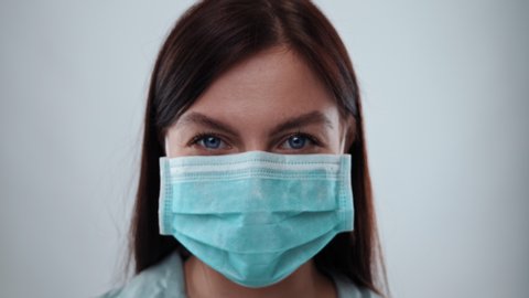 Girl Puts on Medical Mask Portrait. Health Protection Corona Virus Concept