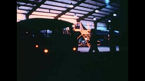 CIRCA 1971 - USAF Majors Widdifield and Sullivan are driven by a van to the SR-71A, which they board in a hangar at Beale Air Force Base.
