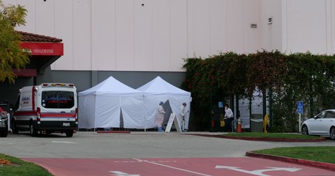 LOS ANGELES, CA/USA - MARCH 16, 2020: Doctors and hospital staff man tents at the Hollywood Presbyterian Hospital emergency entrance during the Coronavirus scare