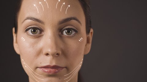 Facelift animation. White lines on woman face showing directions of facelift facial massage