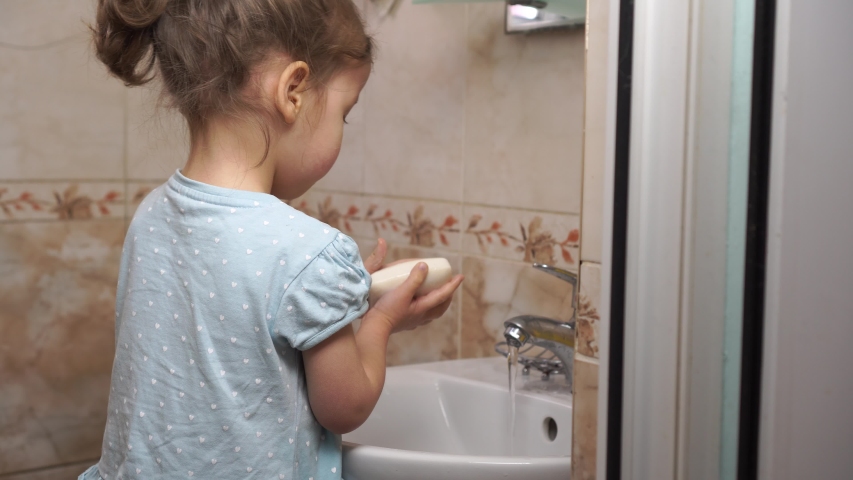 Prevention coronavirus (COVID-19). Handwashing. The child washes his hands with running water and soap. Personal hygiene Royalty-Free Stock Footage #1048482253