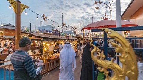 DUBAI, UNITED ARAB EMIRATES (UAE) - circa January, 2020: Crowds of People Walking at Global Village. Hyperlapse