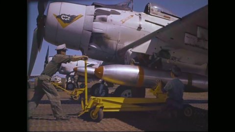 CIRCA 1962 - Bullets, bombs, and rockets are loaded onto Republic of Vietnam Air Force planes.