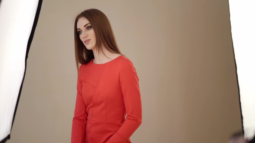 backstage shooting of model girl, photographer in the Studio.