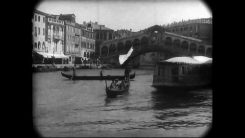 CIRCA 1896 - Boats are rowed along the Grand Canal of Venice.