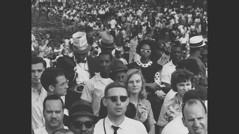 CIRCA 1963 - Crowds of activists applaud as Martin Luther King gives his I Have A Dream speech at the Lincoln Memorial during the March on Washington.