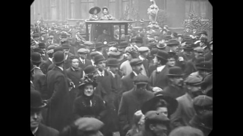CIRCA 1910 - Policemen and crowds of men swarm a suffragette rally in Parliament Square, Westminster, London.