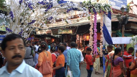 Kolkata, West Bengal, India - April 15th 2019 : Bengali Hindu people visiting famous Kali Temple, a Hindu Goddess,at Kalighat on Bengali new year. Wishing blessings from Goddess on the auspicious day.