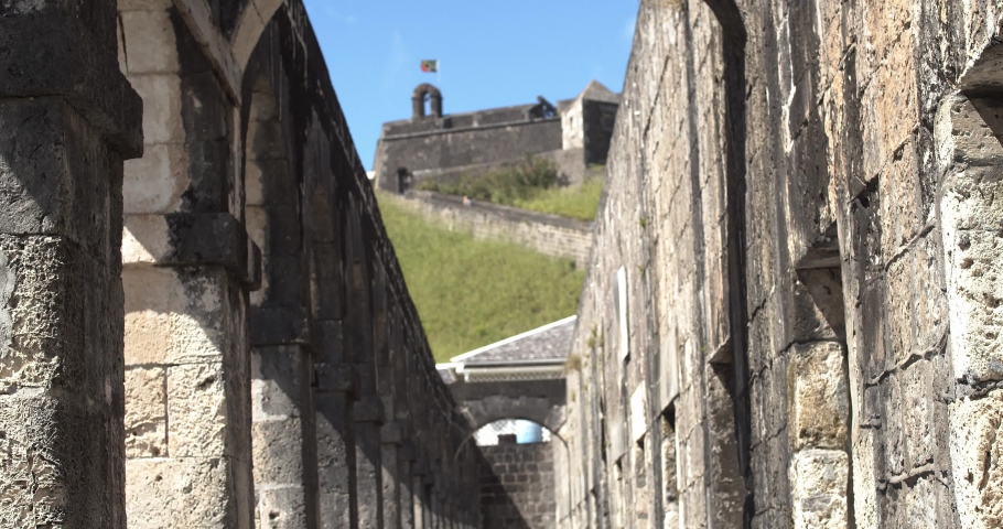 Rack Focused shot at brimstone hill fortress with st. kitts national flag at the top