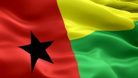 Guinea Bissau waving flag. National 3d Bissau-Guinean flag waving. Sign of Guinea Bissau seamless loop animation. Bissau-Guinean flag HD resolution Background. Guinea Bissau flag Closeup 1080p Full HD
