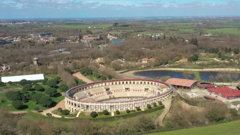 Les Epesses, France - February 2020: drone aerial view above Gallo Roman style coliseum arena, Puy du Fou natural park