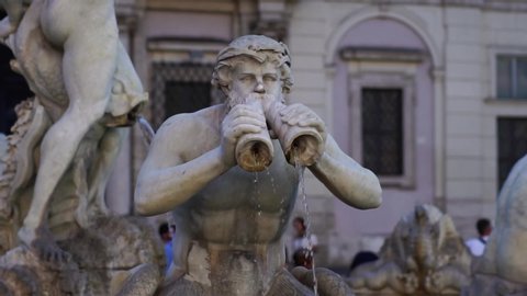 Slow motion, fountain in Piazza Navona in Rome Italy. Steadicam shot. Romantic honeymoon travel destination. Tourism attraction landmark in Europe. 