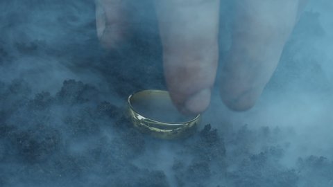 Gold Ring Picked Up In Smoky Fantasy Landscape
