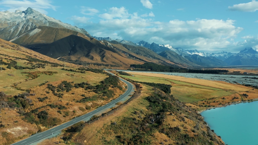 Amazing scenic windy road with mountains and glacier lake, aerial view. MT Cook State Highway 80, New Zealand.