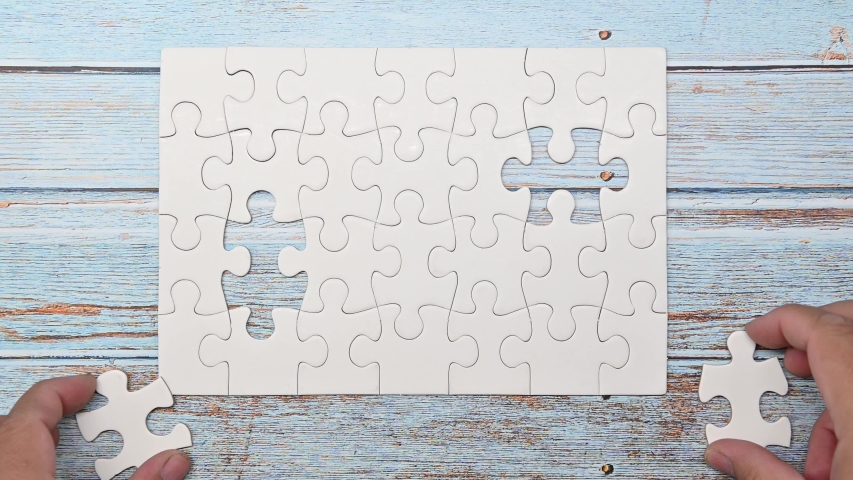 Puzzle for teamwork achievement. Playing jigsaw game. Business successful and goal concept Royalty-Free Stock Footage #1048525030