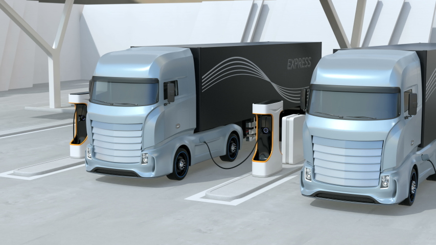 Generic design blue Heavy Electric Trucks charging at Public Charging Station. The charging station equipped  with roof-mounted solar panels. 3D rendering animation. Royalty-Free Stock Footage #1048531177