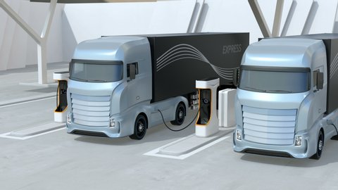 Generic design blue Heavy Electric Trucks charging at Public Charging Station. The charging station equipped  with roof-mounted solar panels. 3D rendering animation.