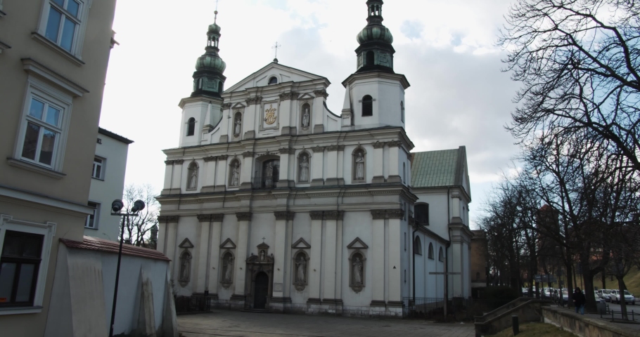 Krakow historic old town church with ornate green copper spires landmark touristic building