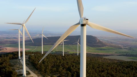 ALICANTE, SPAIN – MARCH 15, 2020. Wind generators of Iberdrola electricity company working in the peak of a mountain range in Spain.