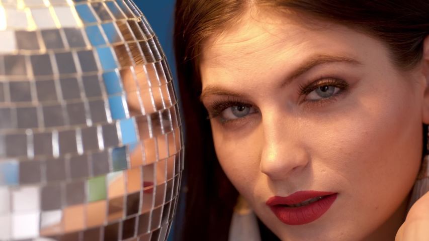 Portrait of a girl in the studio on a blue background.