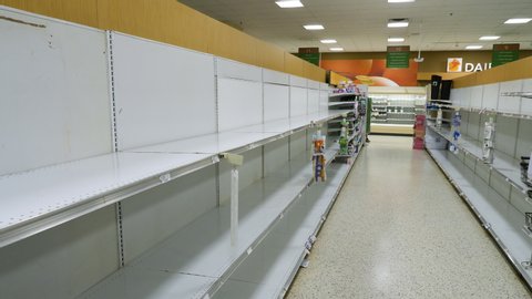 Miami, USA - March 17, 2020: Empty shelves at grocery store. Sold out goods due to covid-19 coronavirus disease. 