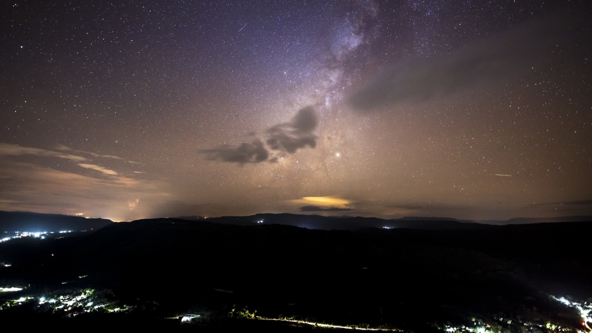 Timelaps of milky way moving above mountain location at north east of thailand 