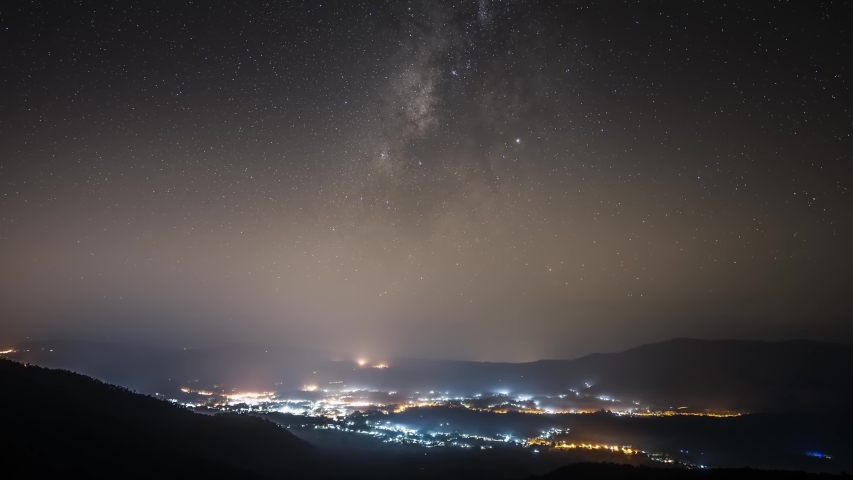 Timelaps of milky way moving above mountain location at north east of thailand 
