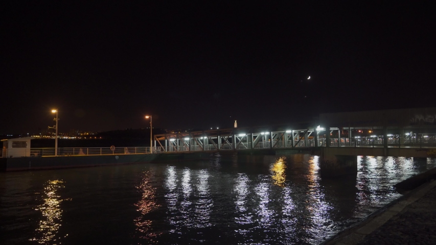 Lisbon river at night with city lights in the back. Shot on Sony a7iii, 4K.