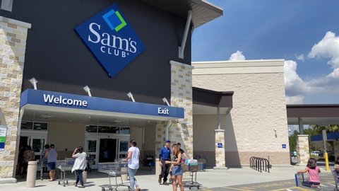Orlando, FL/USA-3/13/20:  People waiting in line to get into a Sams club at 2pm on a Friday during the Coronavirus Covid-19 pandemic