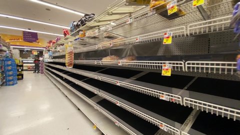Bethesda, Maryland / USA - March 14, 2020: Toilet paper, bread, rice, water and other non perishable foods are sold out at grocery stores across the country during the COVID-19 pandemic.