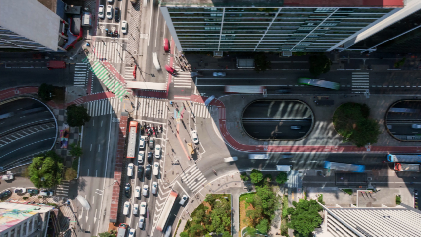  4K UHD Aerial moving timelapse of Paulista Avenue in the morning. Fast-moving São Paulo traffic in main landmark of largest city of Brazil. Long exposure city transportation, concept background. Royalty-Free Stock Footage #1048566355