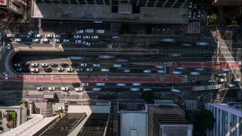  4K UHD Aerial moving timelapse of Paulista Avenue in the morning. Fast-moving São Paulo traffic in main landmark of largest city of Brazil. Long exposure city transportation, concept background.