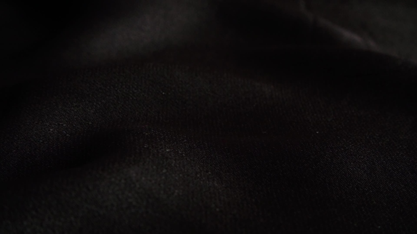 White pearls fall on black fabric. Slow motion. Royalty-Free Stock Footage #1048566910