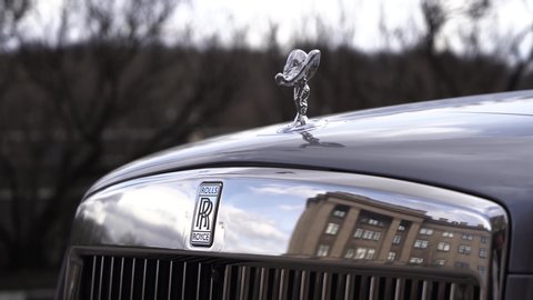 Moscow, Russia - 13 03 2020: Nice footage of Rolls Royce logo hiding under car hood.