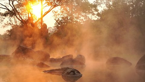 Hot Springs Onsen Natural Bath at National Park Chae Son, Lampang Thailand.In the morning sunrise.Natural hot spring bath surrounded by mountains in northern Thailand.