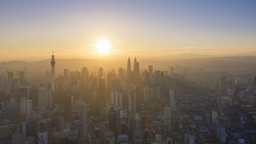 Cityscape Time lapse : Aerial Kuala Lumpur city view during morning overlooking the city skyline with beautiful ray of lights in Malaysia. Royalty-Free Stock Footage #1048604506