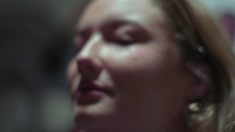 Slow motion shot of crying woman with a tear falling down her cheek