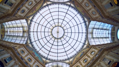 Milan, Italy - March 19, 2020: Empty gallery of Vittorio Emanuele 2 next to the Piazza Duomo. Quarantine from the Covid 19 viral corona in Italy. People. Quarantine in Milan. fish eye. Architecture