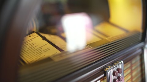 The inside parts of a retro and vintage american fifties juke box in close up with a shallow depth of field.