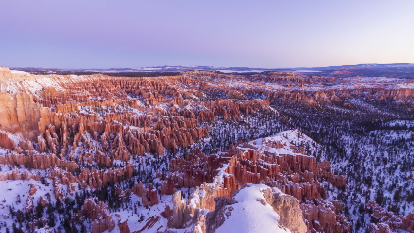 Bryce Canyon Hoodoos at Sunrise in Winter on Sunny Morning. Snow. Bryce Canyon National Park. Utah, USA. Time Lapse