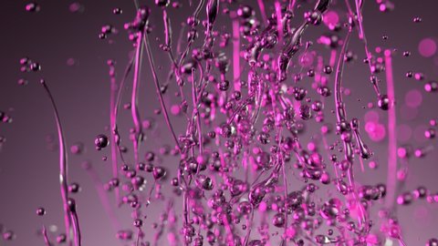 Super Slow Motion Shot of Splashing Oily Violet Liquid on Gradient Background at 1000fps.