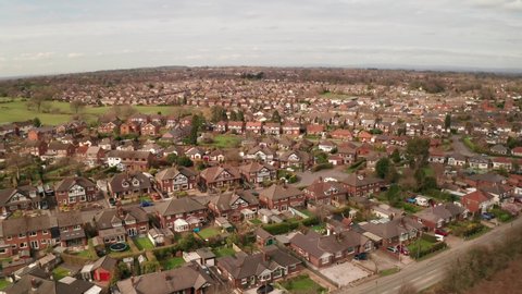 Macclesfield, Cheshire / UK - 03 19 20: Suburban Housing, Cheshire, North West UK. Slow move backwards over rooftops. Drone Clip, Rec 709
