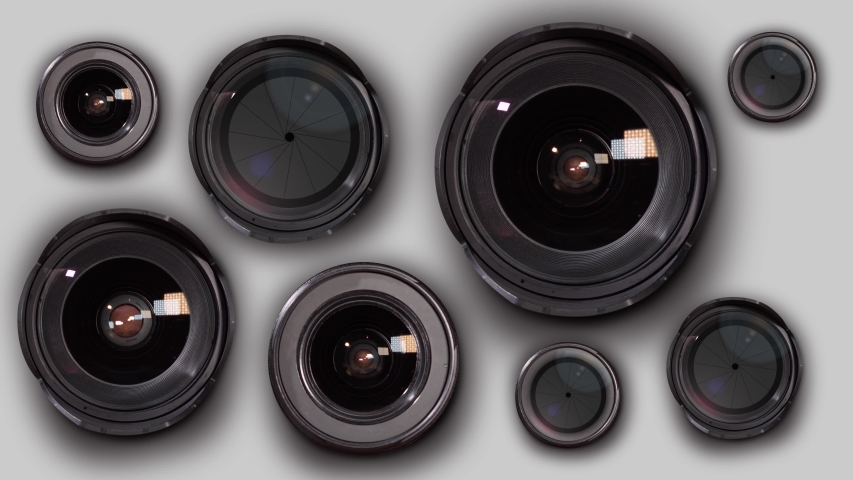 Many photographic lenses in group on a white background