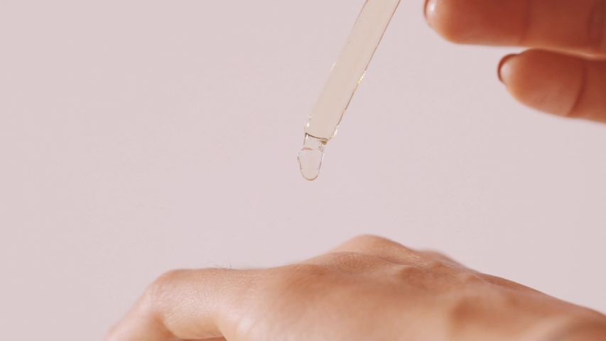 Dripping oil into pipette dropping on the back side of palm close-up view, cosmetology and healthcare, macro shot perfect skin cosmetic products
Self care concept moisturizing and nourishing the skin Royalty-Free Stock Footage #1048632619
