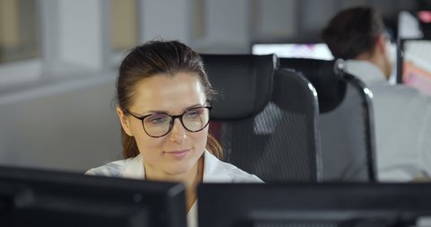 Woman Working On Computer In IT Office, Sitting At Desk Writing Codes. Programmer Typing Data Code, Working On Project In Software Development Company