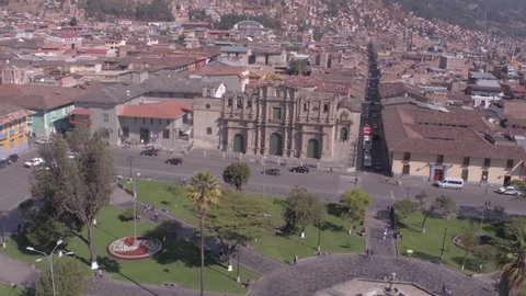Right travelling aerial drone view move of the Cathedral of Cajamarca at the main square of Cajamarca city at a sunny day in Peru