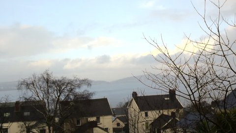 Swansea UK, March 2020: Rain and blue sky in Spring in Mumbles Swansea UK, window view.