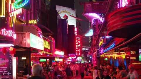 Bangkok, Thailand - January 21, 2020: Famous red light district Soi Cowboy in Bangkok with many clubs, bars and prostitutes. The street is a tourist attraction for night life and entertainment.
